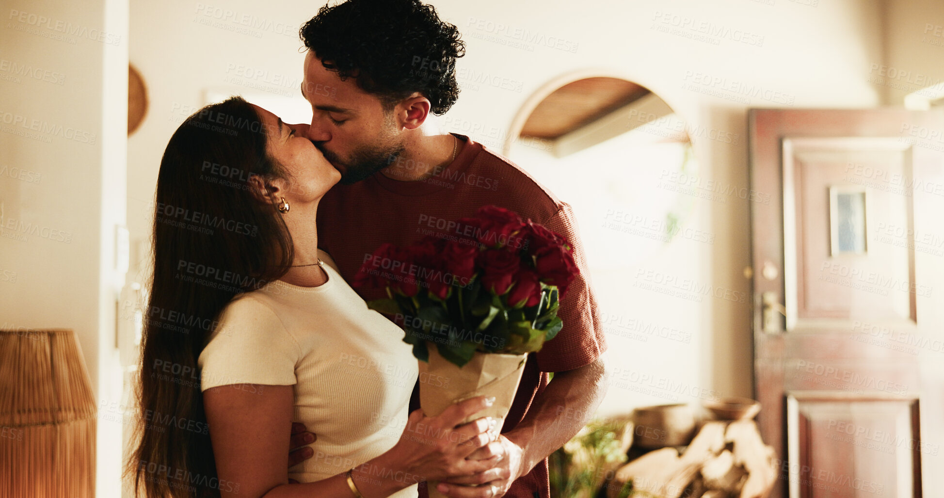 Buy stock photo Love, roses or couple with kiss in home, anniversary present or valentines day gift for connection. Bouquet, relationship milestone celebration or people with affection for support, trust or romance