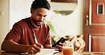 Writing, notes and man with smartphone in house, online and planning for content creation on website. Happy, editor and social media video schedule with journal, remote work and person with mobile