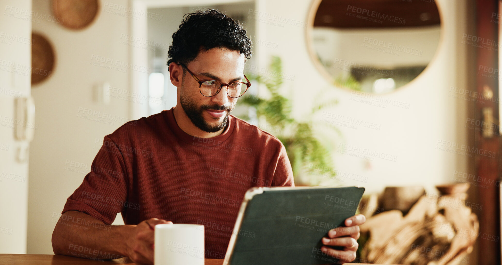 Buy stock photo Morning, coffee and man in home with tablet, online blog post and glasses for reading breaking news. Person, tea and digital tech in house with social media update, connection or website for article.