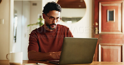 Buy stock photo Man, typing and remote work in home with laptop, research and glasses for proofreading online article. Freelance, journalist and person in apartment with computer, review news report and blog post.