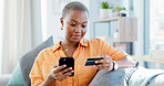 Happy woman, home and online shopping with credit card, phone and payment on website in living room. Digital, purchase and black person with mobile for discount deal, ecommerce and order in house