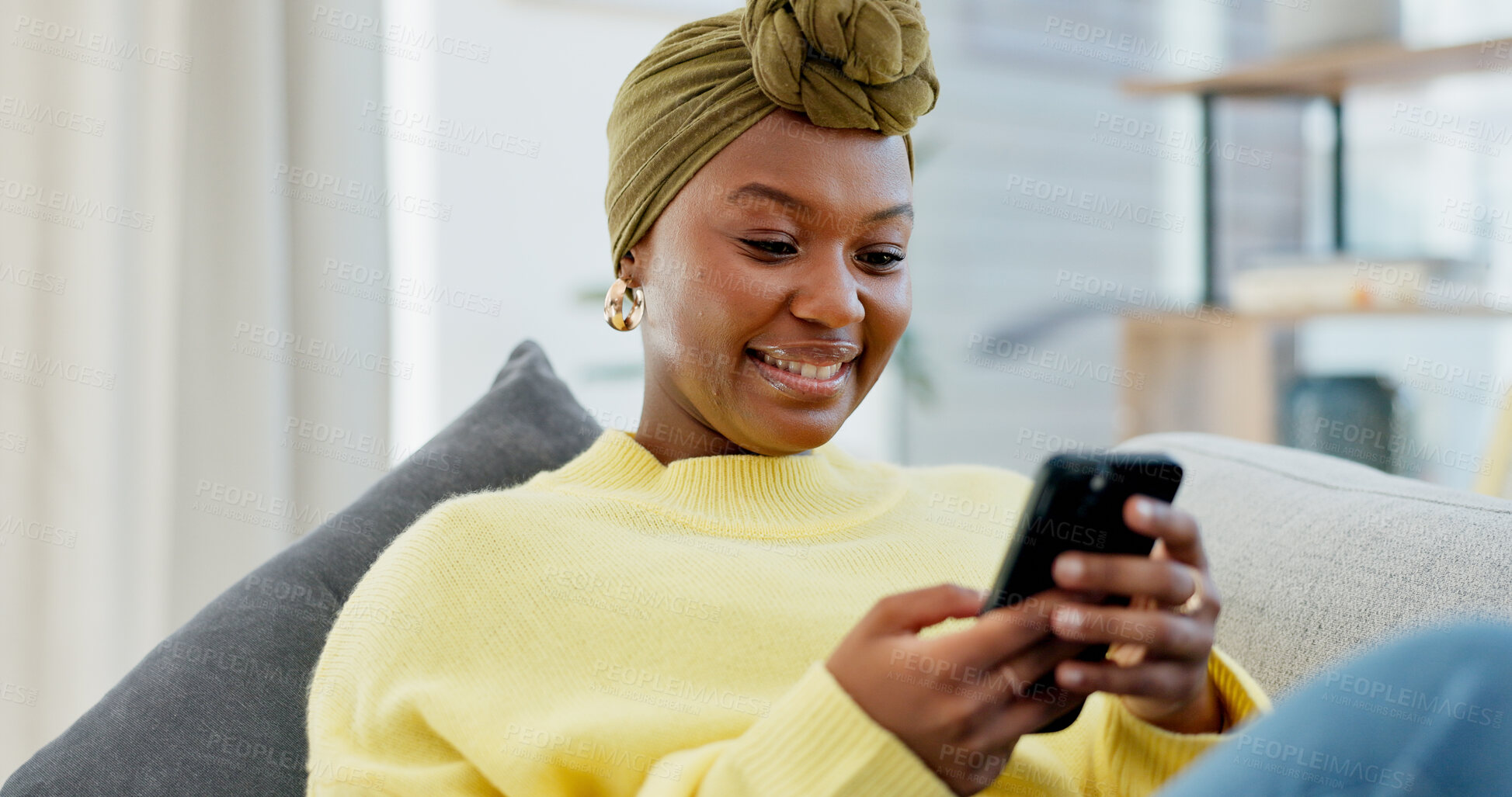 Buy stock photo Reading, smile or woman with phone on sofa, social media app or message notification for networking. Home, online chat or black person with mobile to upload status, browsing internet or blog post