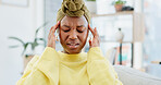 Headache, pain and black woman in home, tired and health risk with pressure in living room. Apartment, brain fog and African person with depression, migraine or tension with fatigue, dizzy or burnout