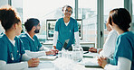Smile, doctors or woman with presentation in boardroom, operation case study or medical resident training. Advice, speaking or surgeon with healthcare students for surgery info, workshop or education