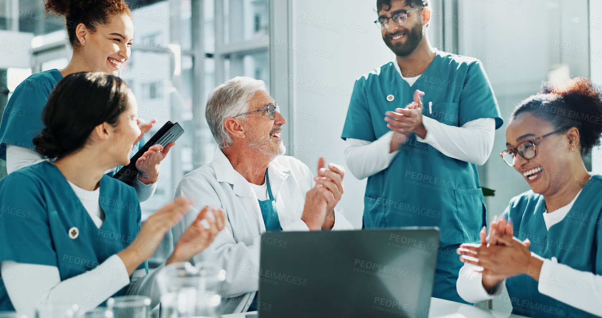 Buy stock photo Applause, man and doctor team with laptop in hospital, congratulations and medical journal success. Publishing approval, support and happy people clapping for healthcare achievement, pc and celebrate