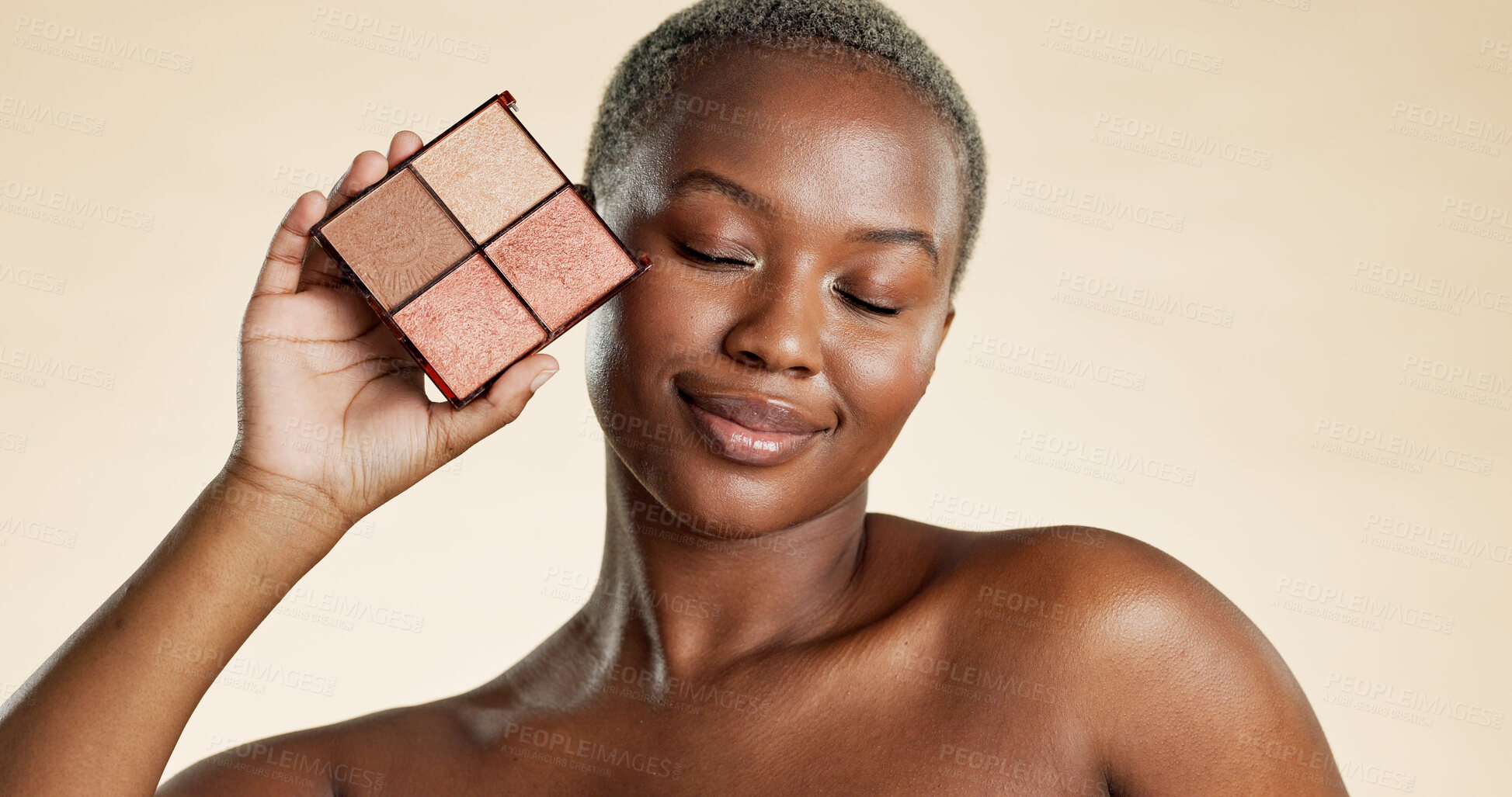 Buy stock photo Makeup, palette and black woman with smile for foundation, highlighter and powder for beauty aesthetic. Happy, female person and cosmetic product for eyeshadow, glow and shine on studio background.