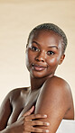 Skincare, happy and portrait of black woman with natural beauty, smooth skin and dermatology. Spa, smile and person with glow, shine or wellness for cosmetics, aesthetic and care on studio background
