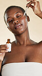 Black woman, beauty and serum with dropper for self care, natural skincare and collagen benefits. Facial, glow and product on studio background for wellness, dermatology and oil for radiance