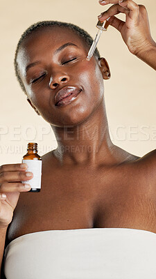 Buy stock photo Black woman, beauty and serum with dropper for self care, natural skincare and collagen benefits. Facial, glow and product on studio background for wellness, dermatology and oil for radiance