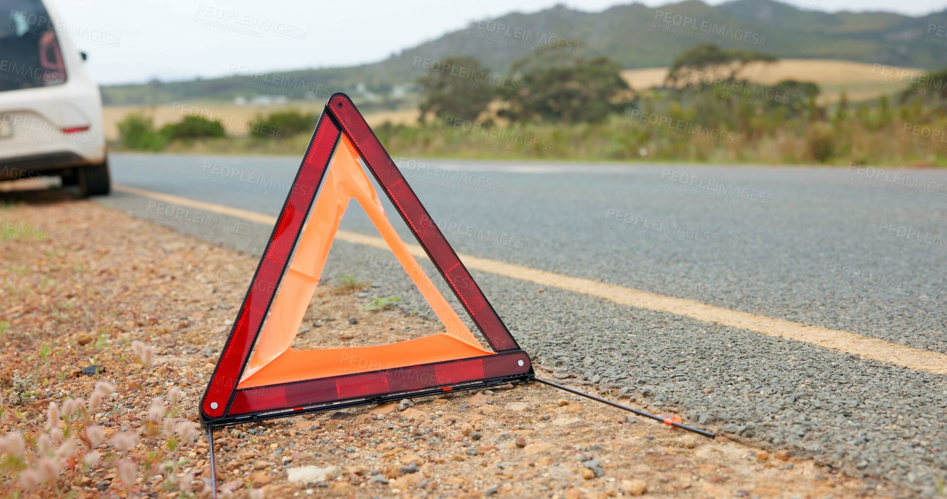 Buy stock photo Roadside, warning and triangle for travel caution for attention, accident and safety precaution. Danger, sign and hazard symbol for transport emergency, deserted road and signal for traffic control