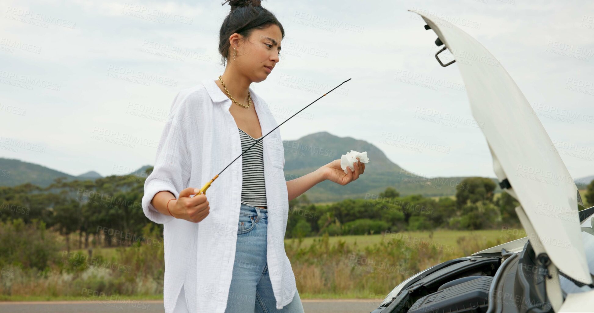 Buy stock photo Woman, hood and inspection of car for travel crisis, oil leak and breakdown from overheating engine. Female person, roadside or dipstick for vehicle diagnosis, maintenance check and mechanical issue