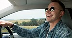 Man, driving and road trip in car with smile, travel vacation and sunglasses for weekend exploration. Driver, person and happy in vehicle with journey, holiday adventure and sightseeing for tourist.