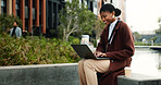 Woman, typing and remote work in city with laptop, online research and copywriting for email marketing. Happy, person and freelancer in urban business park with computer, newsletter and SEO campaign.