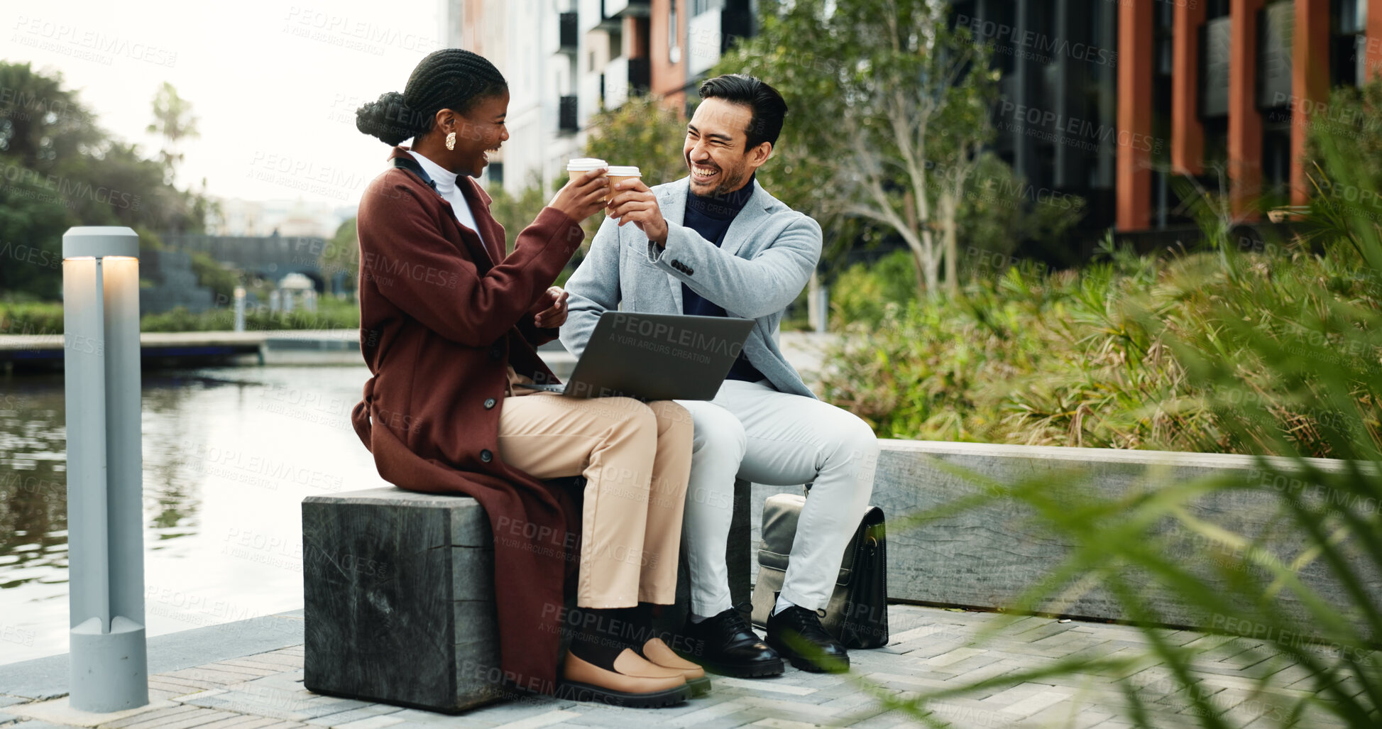 Buy stock photo Coffee, toast and business people with laptop in city, proposal approval and celebration for success. Smile, computer and employees cheers with beverage for project feedback, achievement and winning