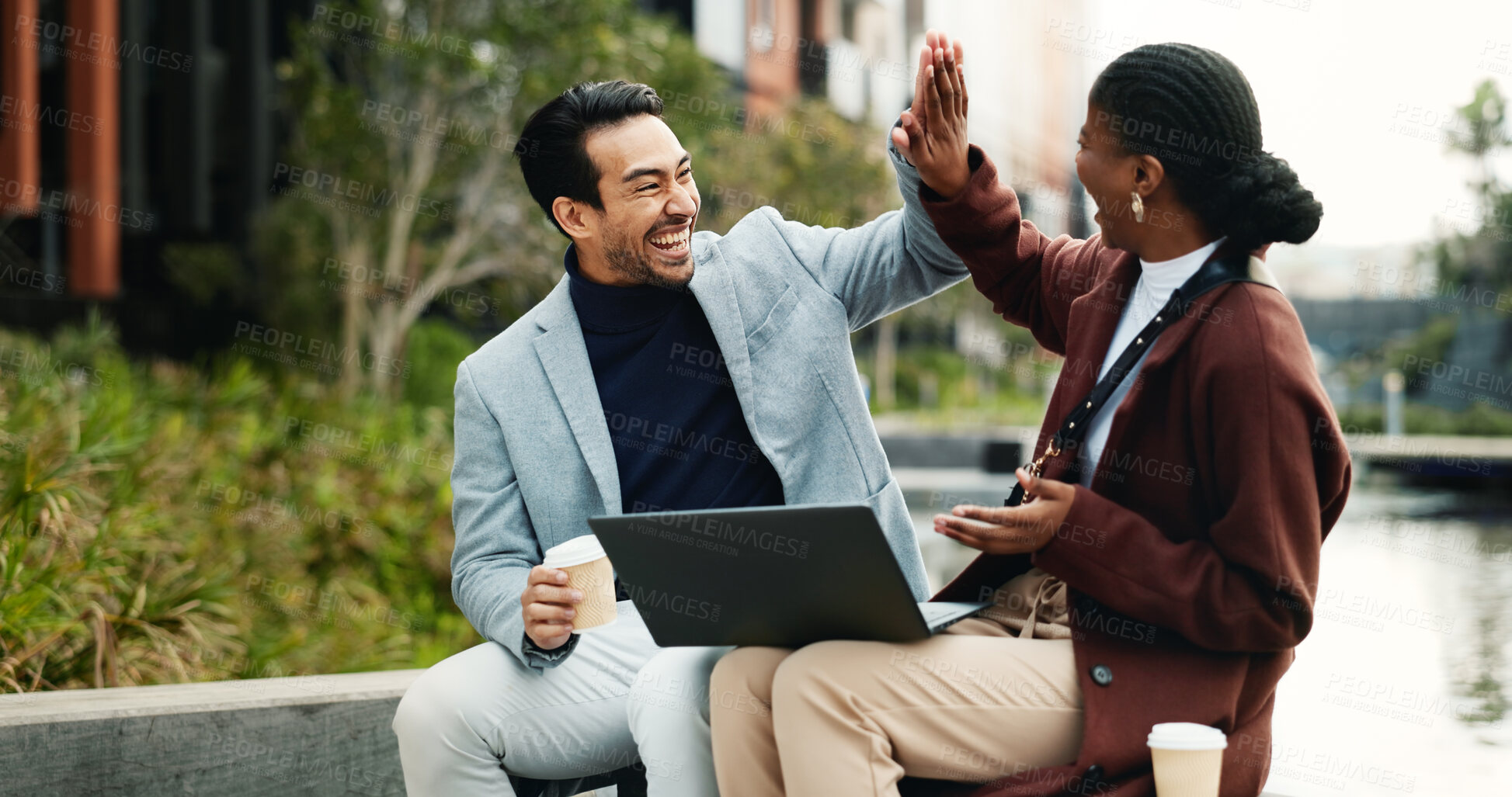 Buy stock photo Laptop, excited and business people in city with high five, remote work or success for email marketing. Team, partnership and celebration in urban town with computer, good news and advertising goals.