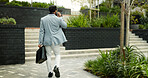 Phone call, walking and back of businessman in city for communication, travel and morning commute. Corporate, finance advisor and person in town on cellphone for consulting, chat and client feedback