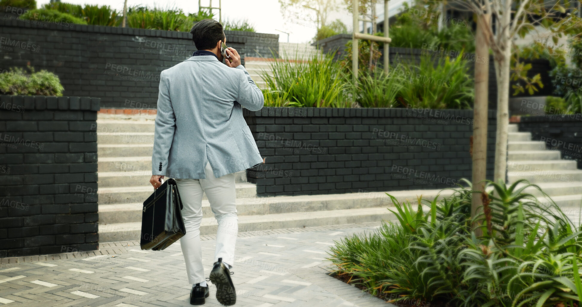 Buy stock photo Phone call, walking and back of businessman in city for communication, travel and morning commute. Corporate, finance advisor and person in town on cellphone for consulting, chat and client feedback