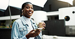 Coffee, walking and black woman in city with earphones for music, thinking and morning commute. Happy, travel and business person with cellphone for streaming audio, podcast and playlist in town