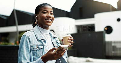 Buy stock photo Coffee, walking and black woman in city with earphones for music, thinking and morning commute. Happy, travel and business person with cellphone for streaming audio, podcast and playlist in town