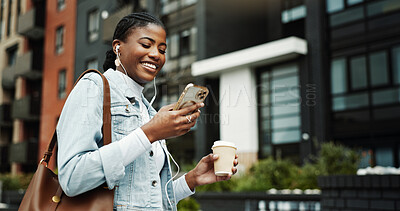 Buy stock photo Phone, walking and black woman in city with earphones for music, internet and coffee on morning commute. Worker, travel and person with cellphone for streaming audio, podcast and playlist in town