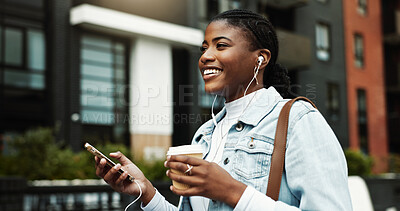 Buy stock photo Coffee, walking and black woman in city with music for travel, journey and morning commute. Happy, business and person with cellphone, earphones and drink for audio, podcast and playlist in town