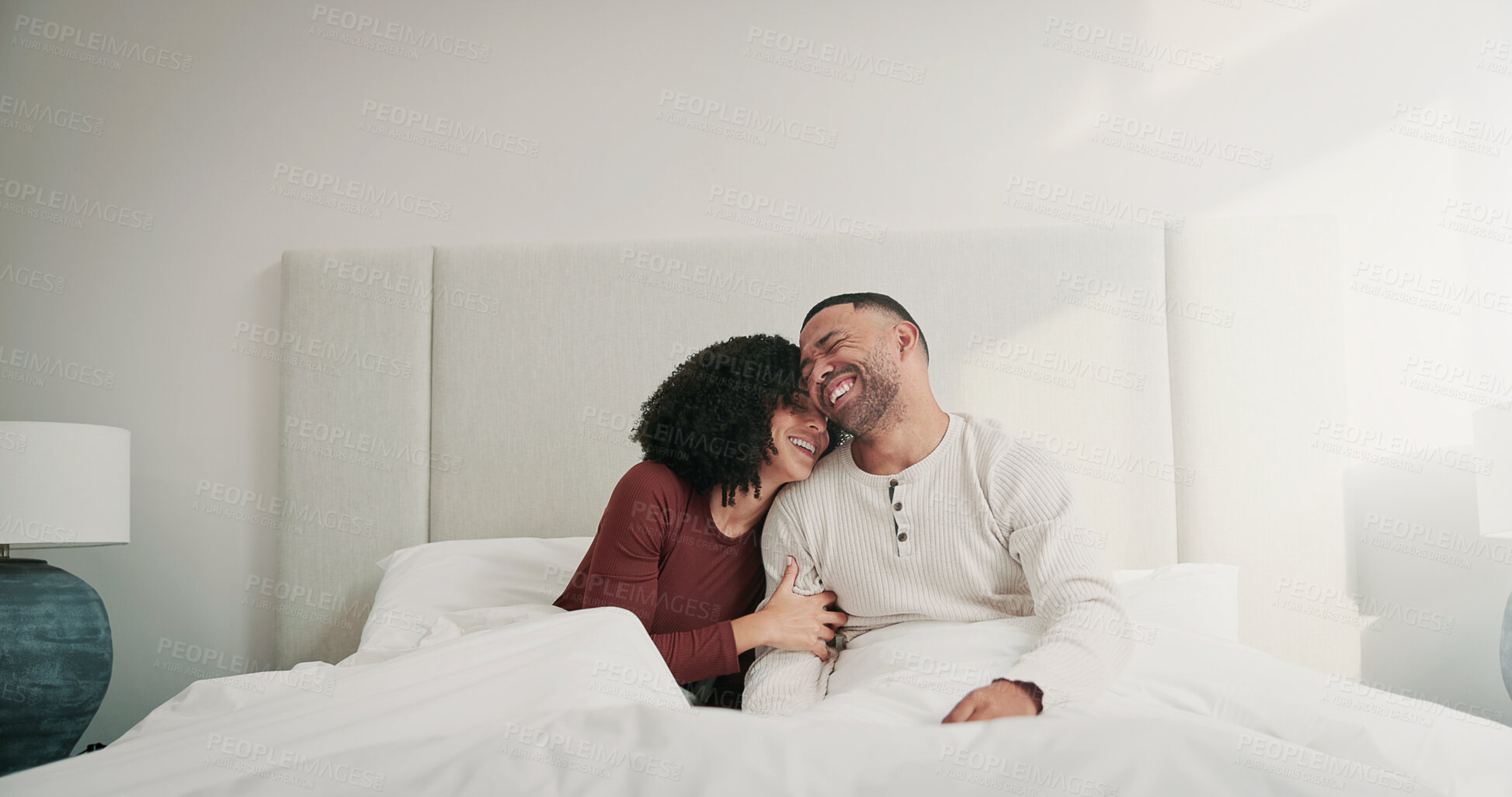 Buy stock photo Smile, couple and relax with love in bedroom from sleeping, romance and cosy weekend. Happy, people or laugh with romantic embrace for partner affection, comfortable break and morning routine in home