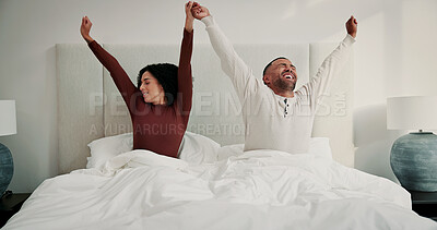 Buy stock photo Couple, stretching and holding hands in bed with love from sleeping, wake up and cosy weekend. People, happiness and positive attitude for stress relief, comfortable nap and morning wellness at house