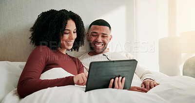 Buy stock photo Relax, smile and couple with tablet in bedroom to watch movie, streaming service and morning bonding. Tech, connection and happy people with film platform for online series, weekend break and home