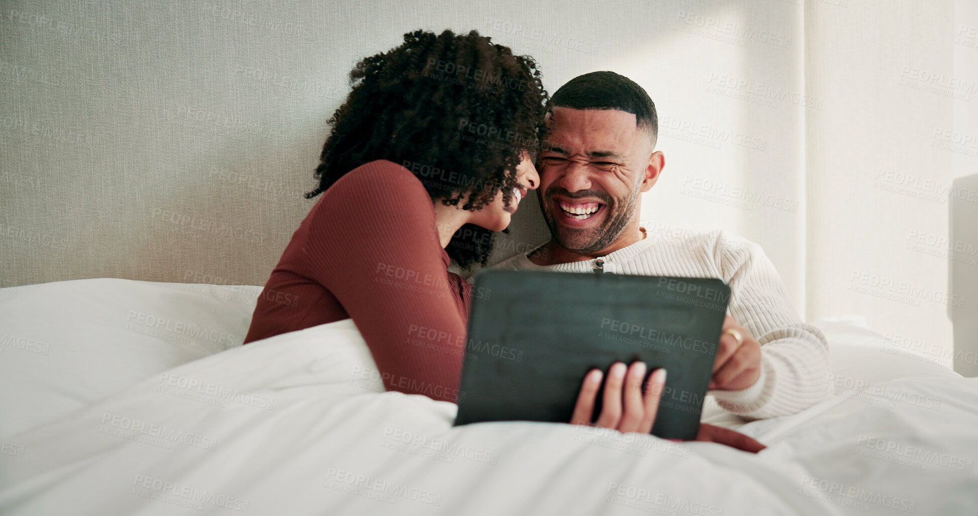 Buy stock photo Tablet, laugh and couple on bed in house with watching comedy movie, series or show together. Happy, relax and man with woman in bedroom with digital technology for streaming film with subscription.