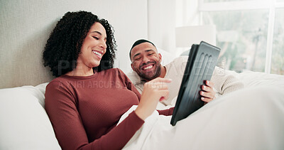 Buy stock photo Happy couple, laugh and relax in bed with tablet, movies and bonding with care, blanket and break in home. Woman, man and tech with relationship, streaming or subscription with application at house