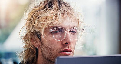 Buy stock photo Laptop, reading and business man with glasses in office for social media marketing or online post. Computer, marketer and person in workplace for engagement info, ads schedule or research review