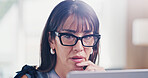 Businesswoman, thinking or reading in office with laptop, review press release or brand management. Mature person, plan or problem solving in agency with computer, glasses or online public relations.