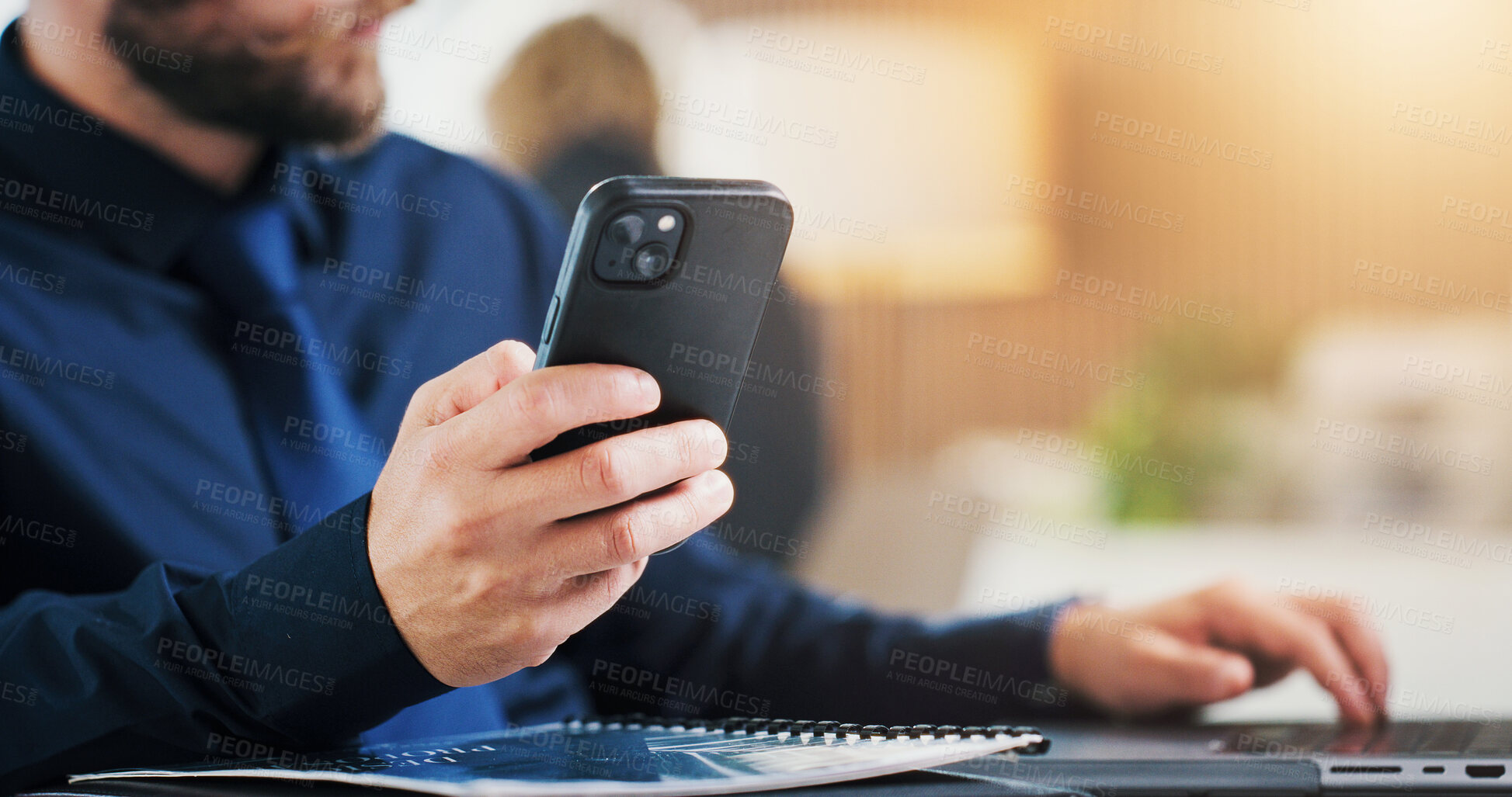 Buy stock photo Phone, hands and businessman with laptop in office for compliance info, research or typing. Mobile, computer and consultant in company for report, risk assessment and regulation policy development