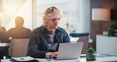 Buy stock photo Businessman, typing and creative with laptop in office, copywriting or blog post on social media app. Business, copywriter and person with tech for article, serious and email marketing on website