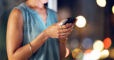 Buy stock photo Night, woman and hands in office with phone, text message and check deadline for marketing project. Late, bokeh and person in business with tech, mobile app or typing update for advertising schedule.