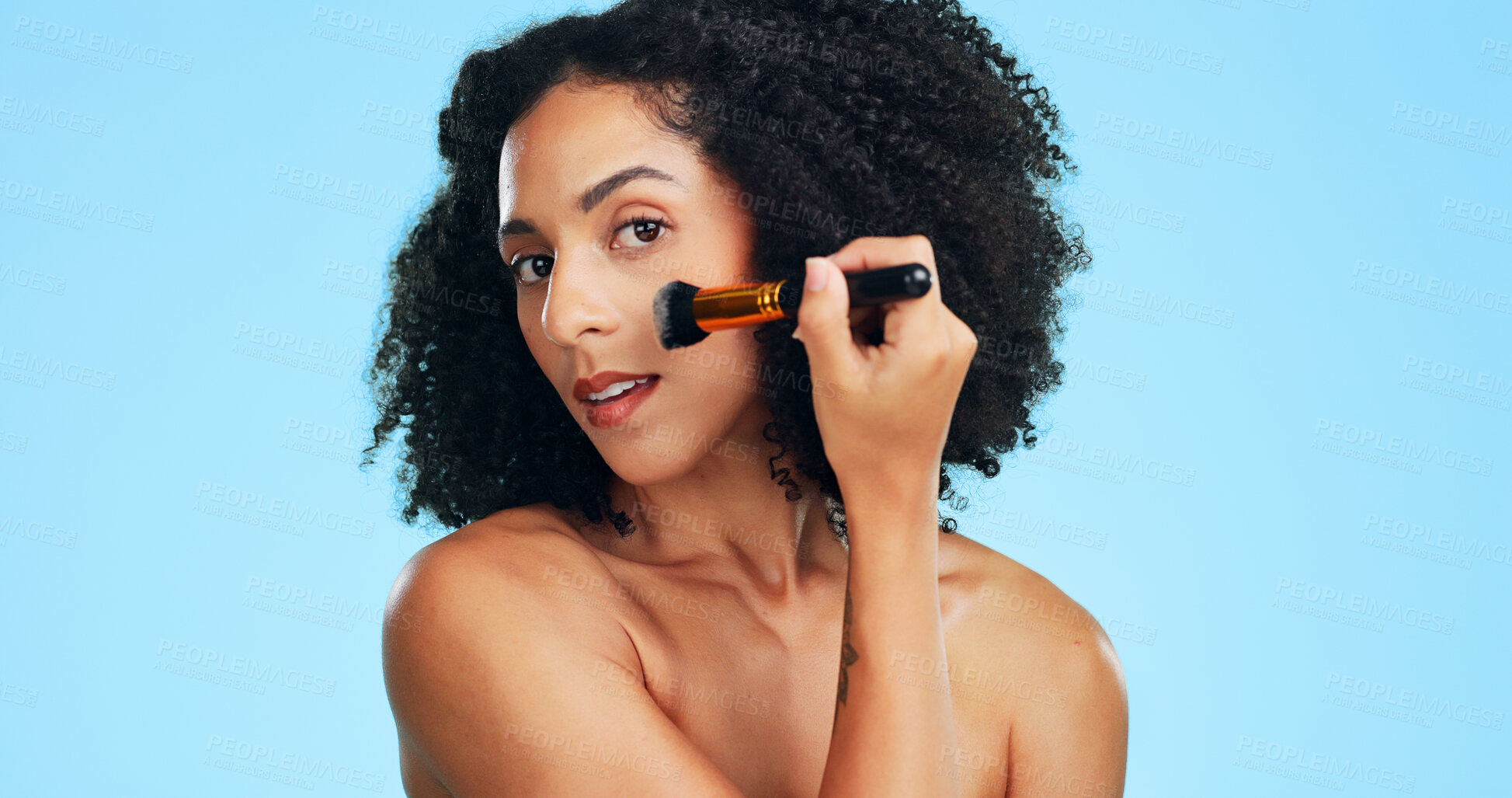 Buy stock photo Portrait, makeup and woman with brush in studio for cosmetics, application and makeover. Cosmetology, space and person with tools for powder, beauty products and salon aesthetic on blue background