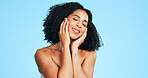 Skincare, soft touch or woman in studio with happiness, shine or glow in facial care. Wellness, space or person on blue background with confidence, dermatology or natural cosmetics for smooth skin.