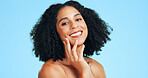 Skincare, portrait or woman in studio with soft touch, shine or glow in facial care. Wellness, space or person on blue background with confidence, dermatology or natural cosmetics for smooth skin.