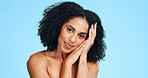 Skincare, portrait or woman in studio with smooth skin, shine or glow in facial care. Wellness, smile or person on blue background with confidence, dermatology or natural cosmetics for soft touch.