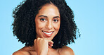 Portrait, smile and woman in studio, skincare and dermatology on blue background. Treatment, aesthetic and person with wellness, shine and beauty for healthy skin, glow and grooming with cosmetics