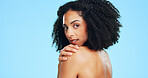 Portrait, skincare and woman in studio for body care, natural glow and wellness with mockup space. Cosmetics, shoulder touch and person with aesthetic, beauty and healthy skin on blue background