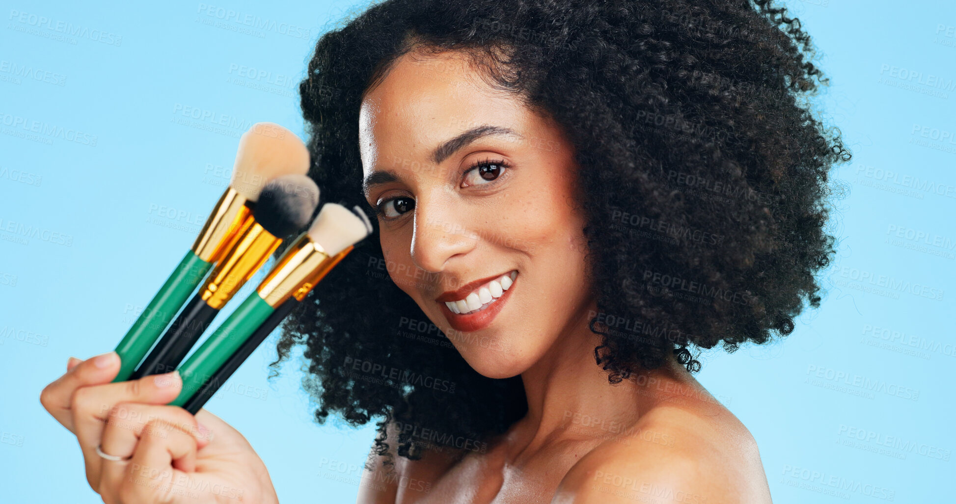 Buy stock photo Makeup, portrait or woman in studio with brushes, coverage or blending in beauty routine. Cosmetology, happy or female person on blue background with tools, makeover or flawless application for glow.