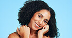 Glow, skincare and happy woman in studio for beauty, natural and wellness on blue background. Cosmetic, smile and portrait of person with aesthetic, dermatology and self care with healthy skin