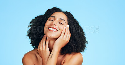 Buy stock photo Smile, skincare and woman in studio for beauty, natural glow and wellness on blue background space. Cosmetic, touch face and happy person with shine, dermatology and self care with healthy skin