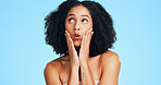 Thinking, skincare and woman in studio with surprise, natural glow or wellness on blue background. Cosmetic idea, dermatology or person with shock for beauty, aesthetic or results with healthy skin
