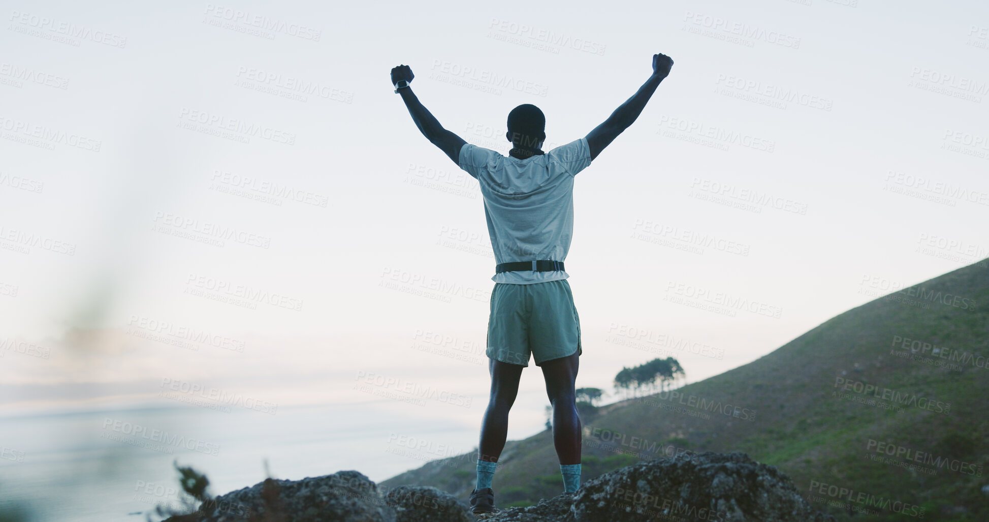 Buy stock photo Hike, back and man on cliff with arms up, cardio goal or celebration in fitness goals. Space, success or person on mountain peak with victory, achievement and milestone reach in outdoor trekking.
