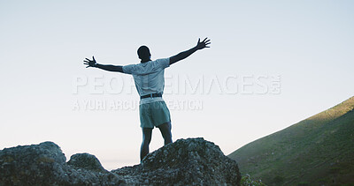 Buy stock photo Hike, success and man on cliff with arms up, cardio goal or celebration in fitness activity. Back, space or male person on mountain with victory, achievement and milestone reach in outdoor trekking.
