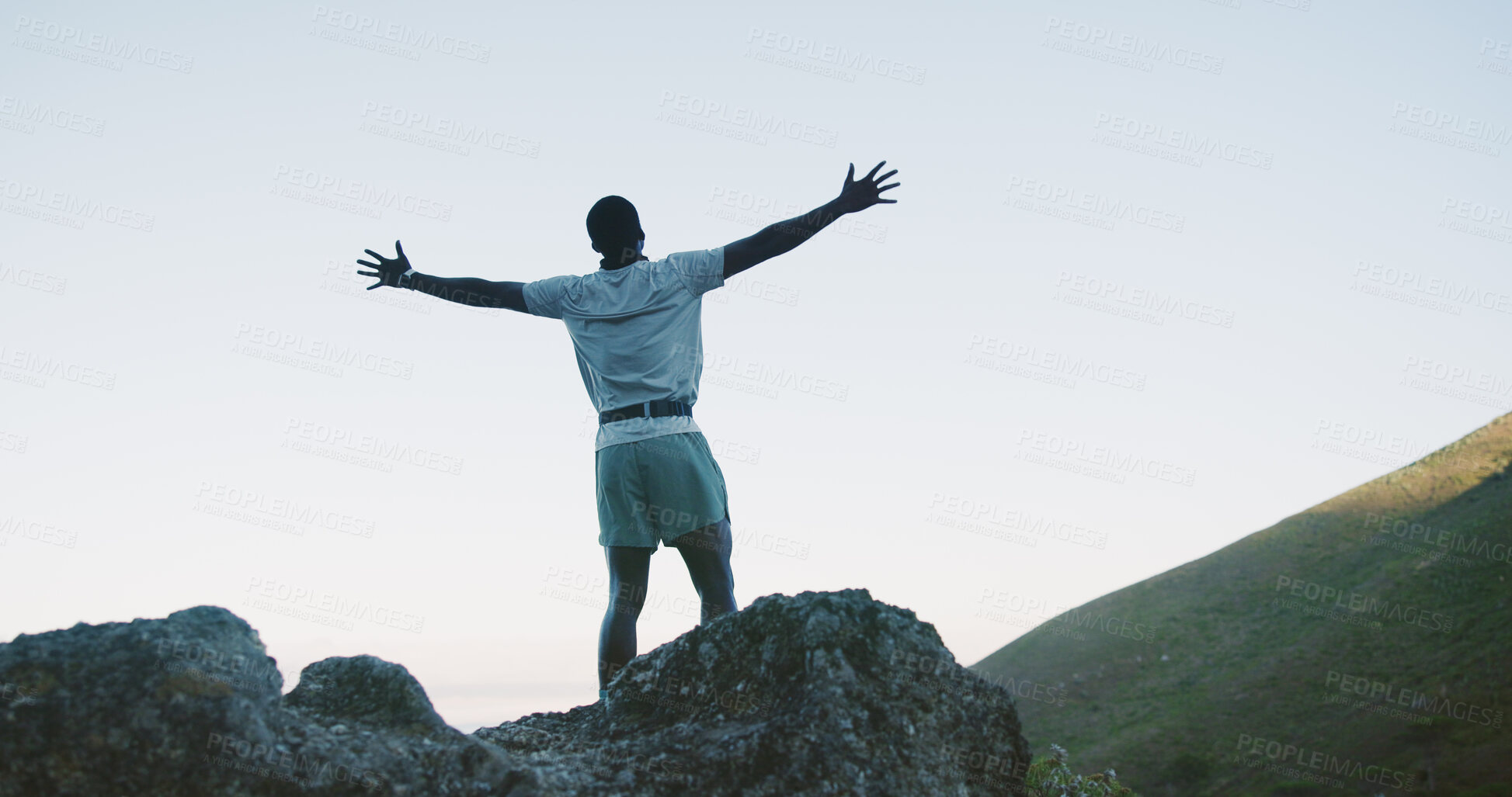 Buy stock photo Hike, success and man on cliff with arms up, cardio goal or celebration in fitness activity. Back, space or male person on mountain with victory, achievement and milestone reach in outdoor trekking.
