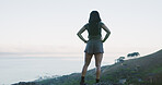 Hiking, back and woman with view of mountain for fitness break, nature appreciation and space. Health, person and trekking destination on hill with sightseeing, ocean scenery and explore for wellness