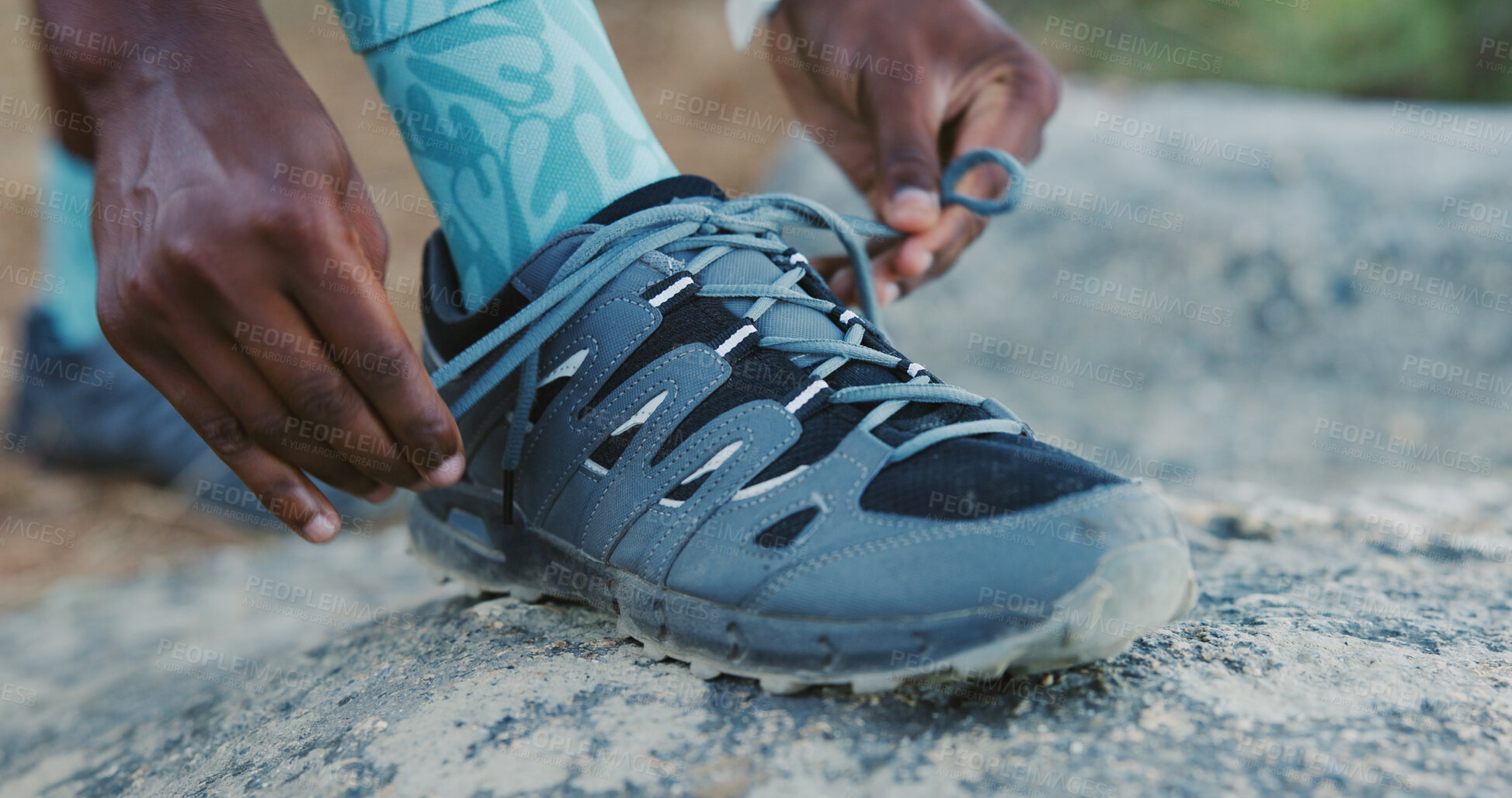 Buy stock photo Person, hands and tying with sneakers on rock for hiking adventure, fitness or exercise preparation. Hiker, tourist or getting ready with laces or shoes for outdoor trekking journey or walk in nature